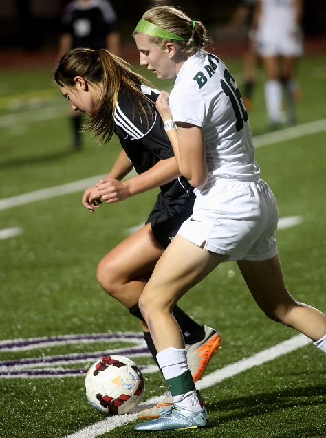 Hey!Hamilton!/E.L. Hubbard Badin midfielder Maddie Smith tries to take the ball from Preble Shawnee defender Ashton Collins during their Division III sectional girls soccer game at Eaton Monday, Oct. 26, 2015. Badin won the contest, 4-0.